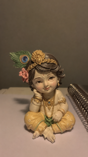 Little Krishna Sitting